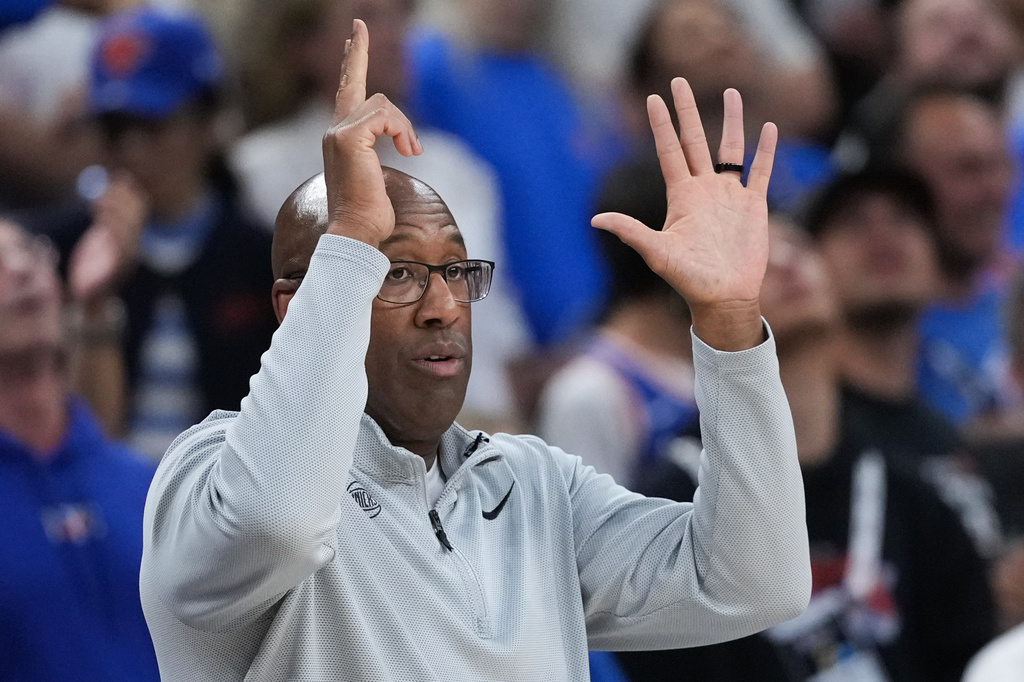 New York Knicks head coach Mike Brown makes a call during the first half of Game 2 of the NBA Finals basketball series against the San Antonio Spurs, Friday, June 5, 2026, in San Antonio. (AP Photo/Eric Gay)