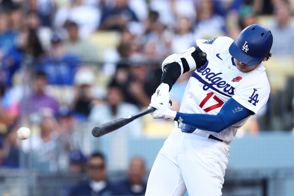 Los Angeles Dodgers' Shohei Ohtani hits a double during the first inning of a baseball game against the Colorado Rockies, Monday, May 25, 2026, in Los Angeles. (AP Photo/Jessie Alcheh)