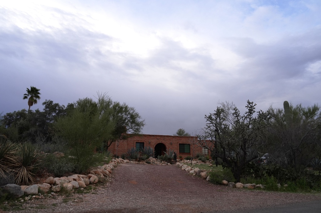 Nancy Guthrie’s home is seen in the early morning under cloudy skies on Friday, Feb. 13, 2026 in Tucson, Ariz. (AP Photo/Ty ONeil)
