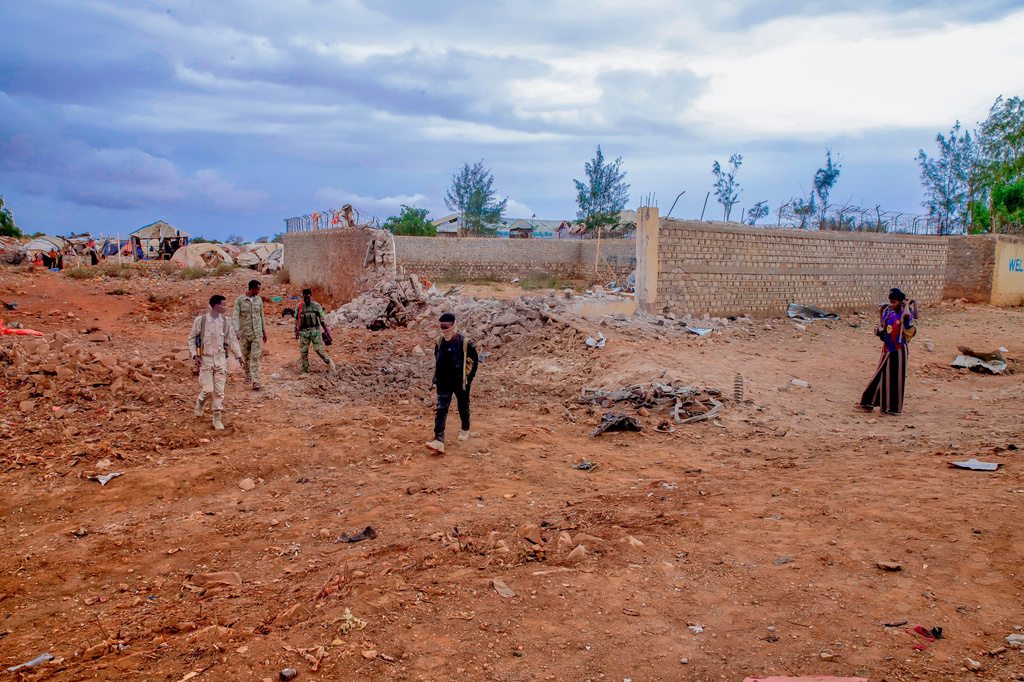 Government troops patrol alongside government officials after clashes with militias that killed dozens of people, including civilians, in Baidoa, Somalia, Monday, Aug. 17, 2026. (AP Photo)