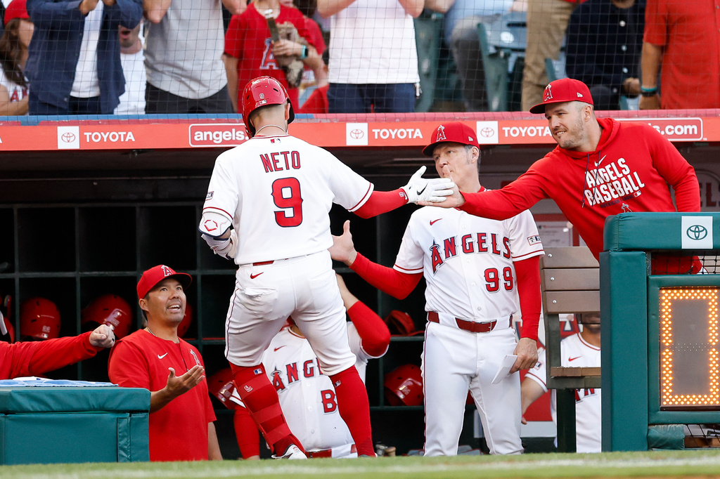 Los Angeles Angels' Zach Neto (9) is greeted by teammates after hitting a home run during the first inning of a baseball game against the Atlanta Braves, Monday, April 6, 2026, in Anaheim, Calif. (AP Photo/Caroline Brehman)