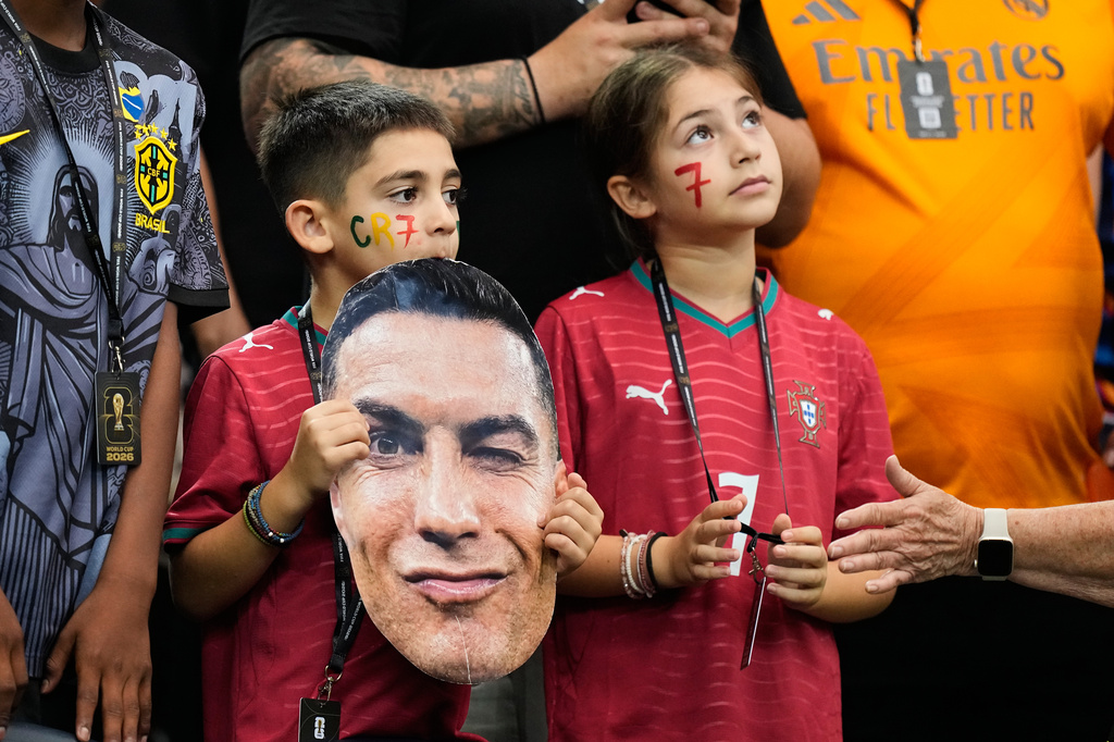 Young fans hold a photo of Portugal's Cristiano Ronaldo before the World Cup round of 16 soccer match against Spain in Arlington, Texas, near Dallas, Monday, July 6, 2026. (AP Photo/Ashley Landis)