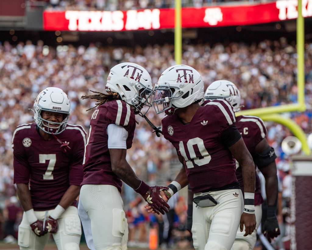 Texas A&amp;M wide receiver KC Concepcion (7), Texas A&amp;M wide receiver Mario Craver (1) and Texas A&amp;M quarterback Marcel Reed (10) celebrate a touchdown against Florida during an NCAA college football game Saturday, Oct. 11, 2025, in College Station, Texas. (Meredith Seaver/College Station Eagle via AP)