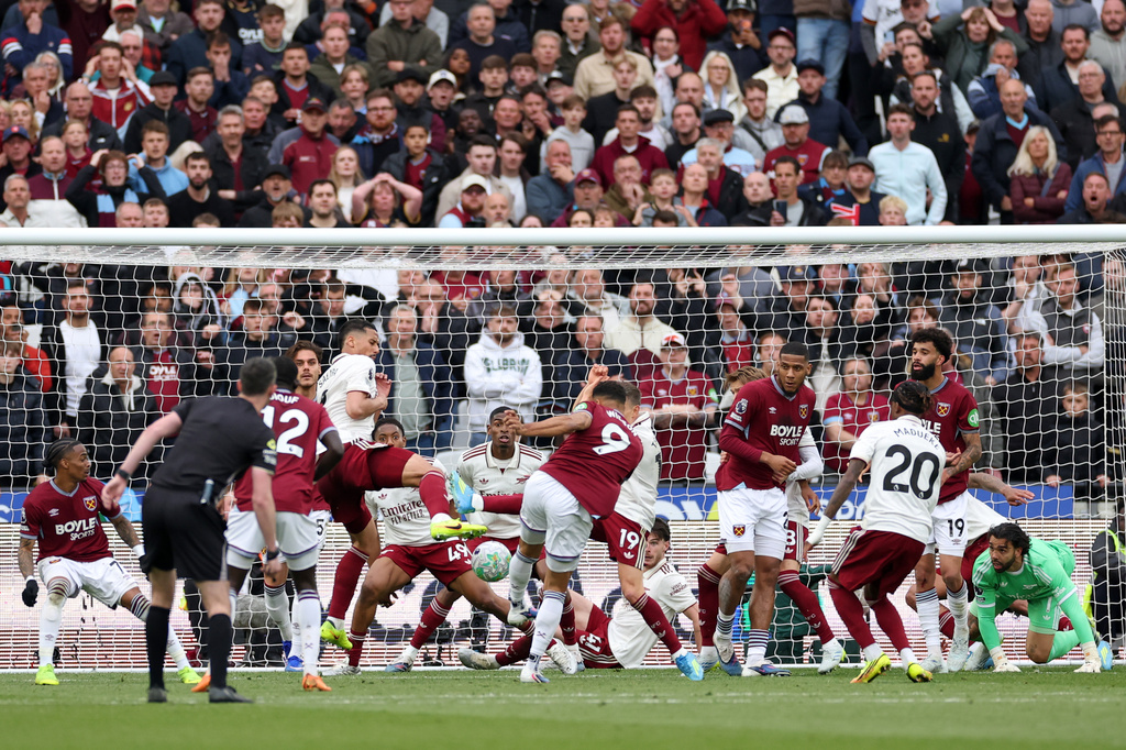 West Ham's Callum Wilson, center, scores a goal that was later disallowed following a video review during the Premier League soccer match between West Ham and Arsenal in London, Sunday, May 10, 2026. (AP Photo/Ian Walton)