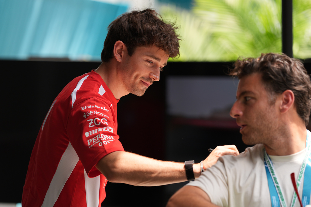 Ferrari driver Charles Leclerc, of Monaco, signs a fans shirt ahead of the Formula One Miami Grand Prix auto race, Thursday, April 30, 2026, in Miami Gardens, Fla. (AP Photo/Rebecca Blackwell)