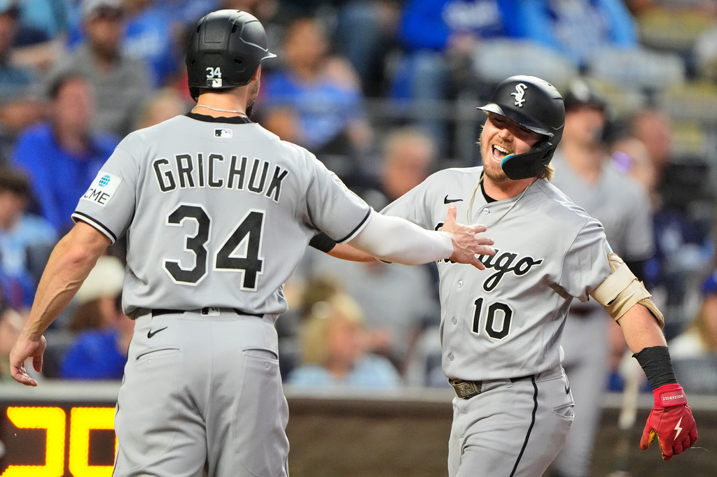Chicago White Sox's Chase Meidroth (10) celebrates with Randal Grichuk after hitting a three-run home run during the third inning of a baseball game against the Kansas City Royals, Tuesday, Sept. 22, 2026, in Kansas City, Mo. (AP Photo/Charlie Riedel)