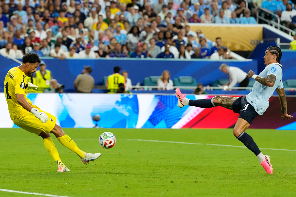 Cape Verde goalkeeper Vozinha (1) kicks the ball clear of Uruguay's Darwin Nunez (9) during the World Cup Group H soccer match between Uruguay and Cape Verde in Miami Gardens, Fla., Sunday, June 21, 2026. (AP Photo/Rebecca Blackwell)