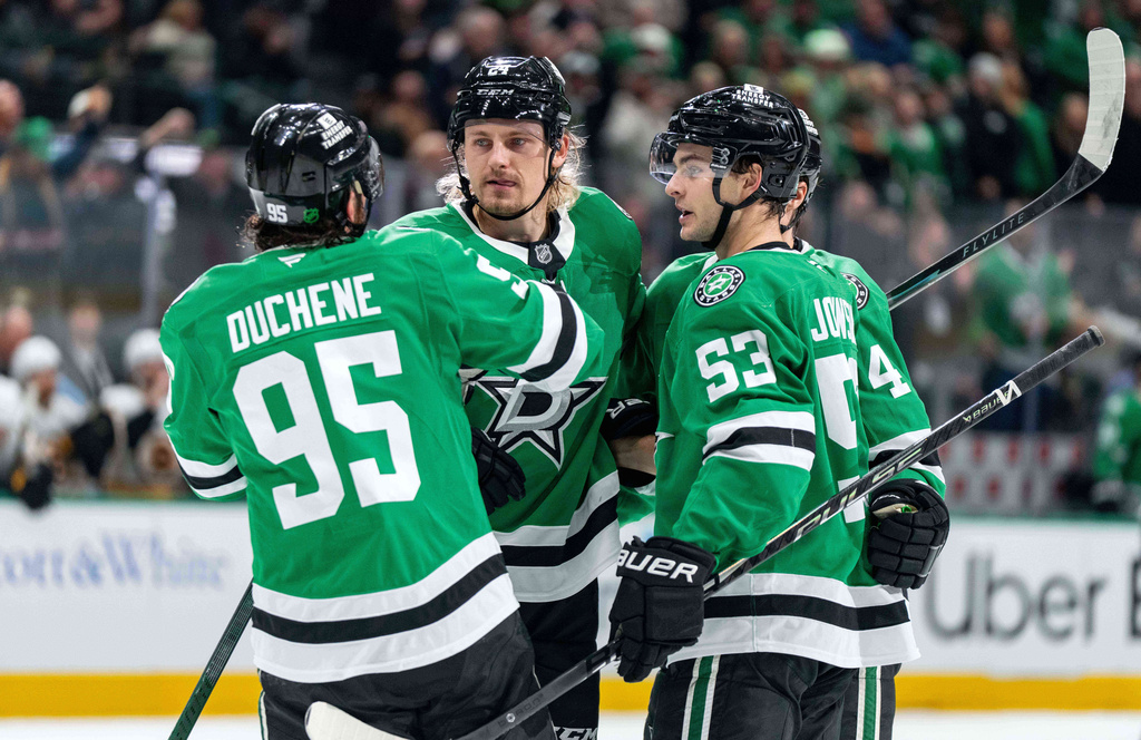 Dallas Stars center Matt Duchene (95), center Roope Hintz, second from left, center Wyatt Johnston (53) and defenseman Miro Heiskanen (4) celebrate Johnston's goal during the first period of an NHL hockey game against the Boston Bruins, Tuesday, Jan. 20, 2026, in Dallas. (AP Photo/Jeffrey McWhorter)