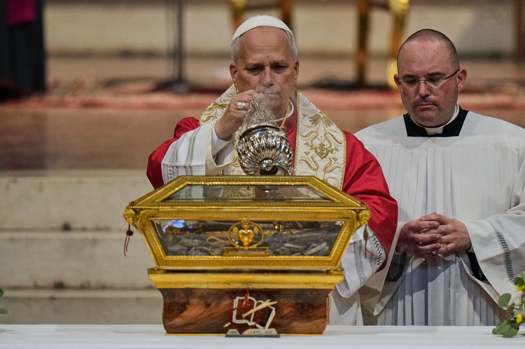 Pope Leo XIV incenses the relics of St. Augustine as he visits the San Pietro in Ciel d'Oro Basilica in Pavia, northern Italy, Saturday, June 20, 2026. (AP Photo/Luca Bruno)
