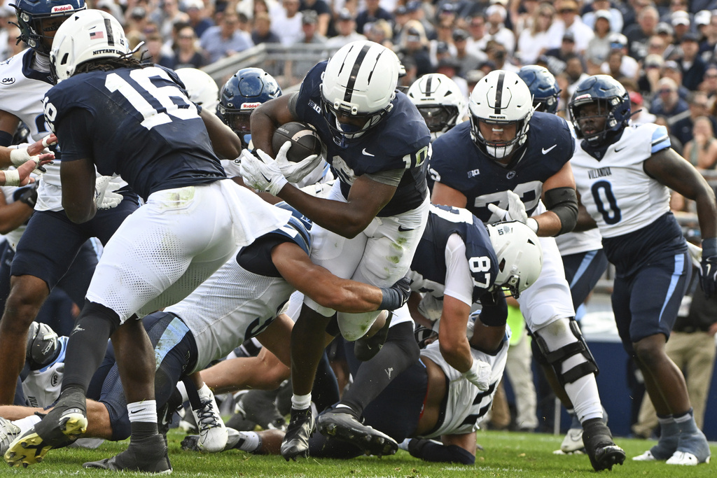 Penn State running back Nicholas Singleton (10) scores a touchdown against Villanova during the first quarter of an NCAA college football game, Saturday, Sept. 13, 2025, in State College, Pa. (AP Photo/Barry Reeger)