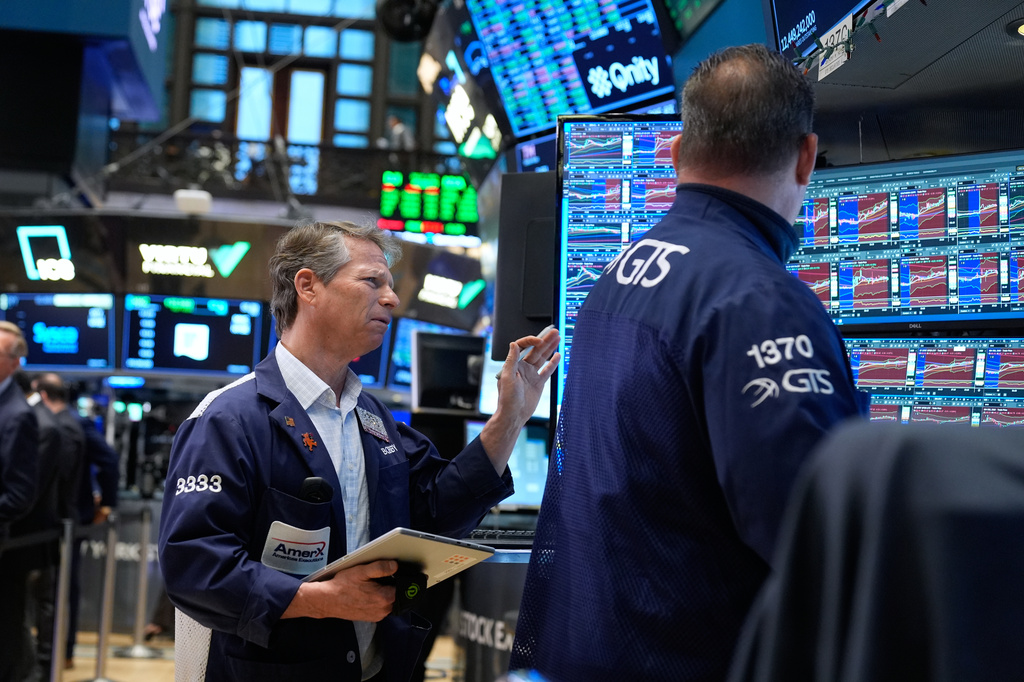 Bobby Charmak works on the floor at the New York Stock Exchange in New York, Monday, March 30, 2026. (AP Photo/Seth Wenig)