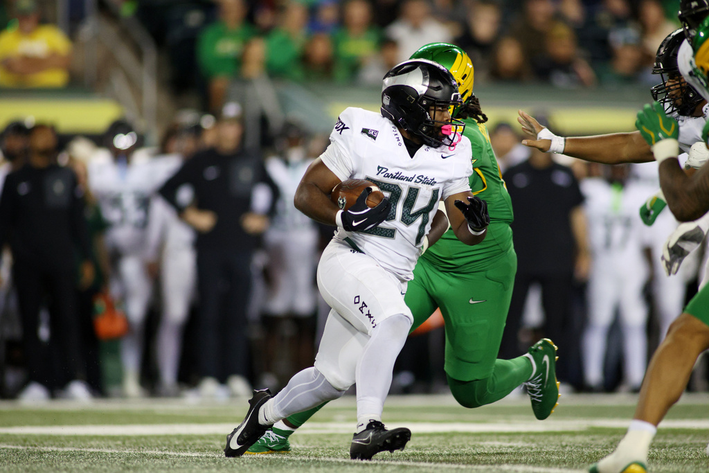 Portland State running back Delon Thompson (24) runs the ball during the first half of an NCAA college football game against Oregon, Friday, Sept. 18, 2026, in Eugene, Ore. (AP Photo/Lydia Ely)