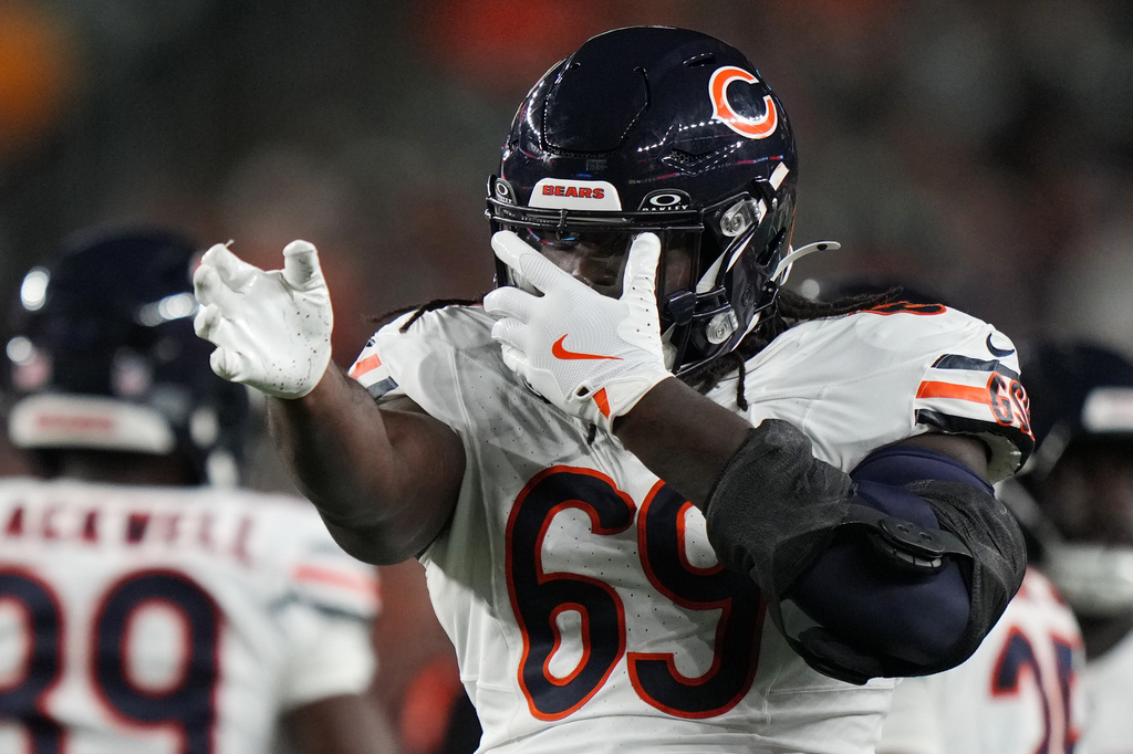 Chicago Bears defensive lineman Jeremiah Martin (69) celebrates after stopping Cincinnati Bengals wide receiver Kendric Pryor during the second half of a preseason NFL football game Saturday, Aug. 22, 2026, in Cincinnati. (AP Photo/Joshua A. Bickel)