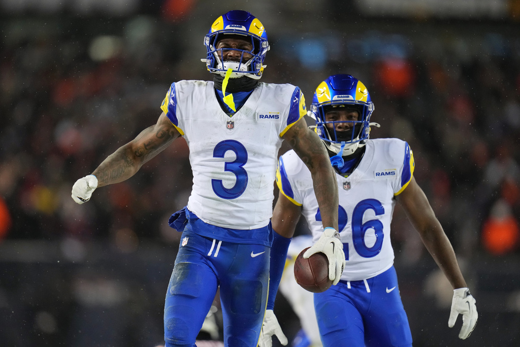 Los Angeles Rams safety Kam Curl (3) reacts with safety Kamren Kinchens (26) after intercepting a pass by Chicago Bears quarterback Caleb Williams, not visible, during overtime of an NFL football divisional playoff game Sunday, Jan. 18, 2026, in Chicago. (AP Photo/Jeff Roberson)