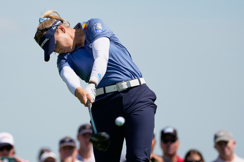 Brooke M. Henderson, of Canada, hits her tee shot on the third hole during the third round at the Women's PGA Championship golf tournament at the Hazeltine National Golf Club, Saturday, June 27, 2026, in Chaska, Minn. (AP Photo/Chris Carlson)