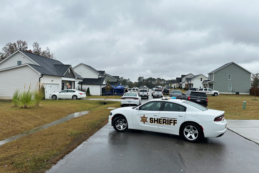Law enforcement vehicles block the road to Wellington Delano Dickens III's home, where remains were found after Dickens told authorities he had killed four of his children, in Zebulon, N.C., on Tuesday, Oct. 28, 2025. (AP Photo/Allen G. Breed) Law enforcement vehicles block the road to Wellington Delano Dickens III's home, where remains were found after Dickens told authorities he had killed four of his children, in Zebulon, N.C., on Tuesday, Oct. 28, 2025. (AP Photo/Allen G. Breed)