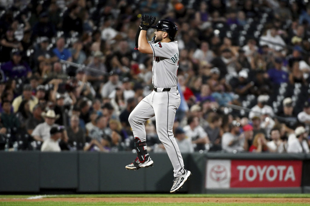 Arizona Diamondbacks' Adrian Del Castillo celebrates after hitting a two-run home run in the seventh inning of a baseball game against the Colorado Rockies, Saturday, Aug. 16, 2025, in Denver. (AP Photo/Geneva Heffernan)