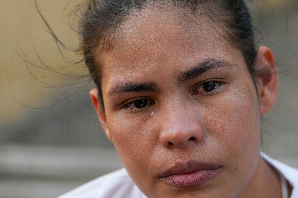 Sandra Rosales, whose husband is detained at a different facility, cries outside the Zona 7 detention center of the Bolivarian National Police, after listening to lawmakers debate an amnesty bill at the National Assembly, in Caracas, Venezuela, Thursday, Feb. 12, 2026. (AP Photo/Ariana Cubillos)
