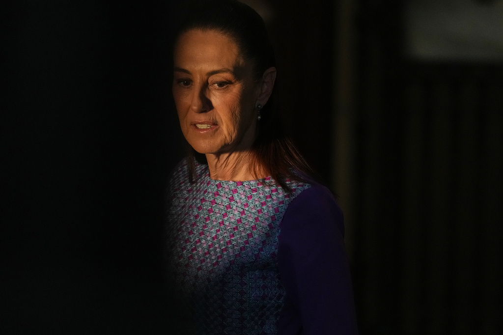 Mexican President Claudia Sheinbaum arrives at the National Palace to give her daily morning press conference in Mexico City, Thursday, April 30, 2026. (AP Photo/Fernando Llano)