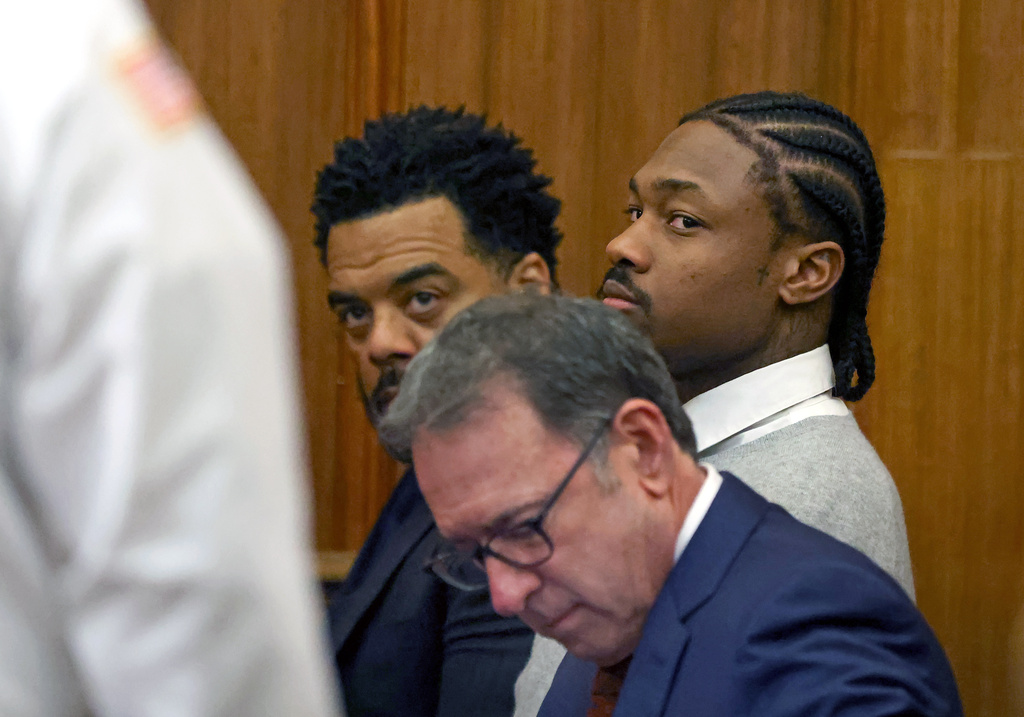 New England Patriots' Stefon Diggs, right, appears for his arraignment on felony strangulation and a misdemeanor assault charges, Friday, Feb. 13, 2026, at District Court in Dedham, Mass. (David L. Ryan/The Boston Globe via AP, Pool)