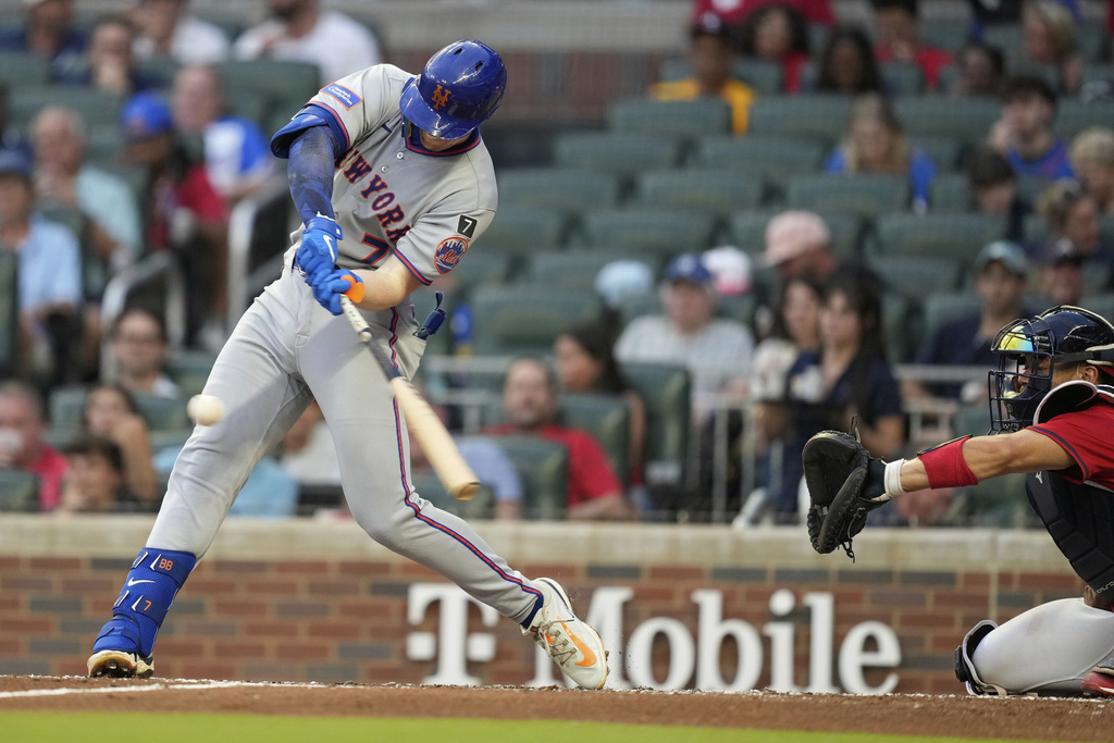 New York Mets' Brett Baty (7) hits a double in the third inning of a baseball game against the Atlanta Braves, Friday, Aug. 22, 2025, in Atlanta. (AP Photo/Brynn Anderson)
