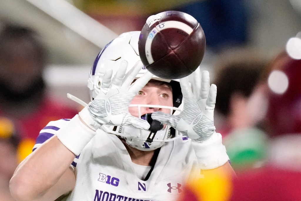 Northwestern wide receiver Drew Wagner catches a pass during the first half of an NCAA college football game against Southern California, Friday, Nov. 7, 2025, in Los Angeles. (AP Photo/Mark J. Terrill)