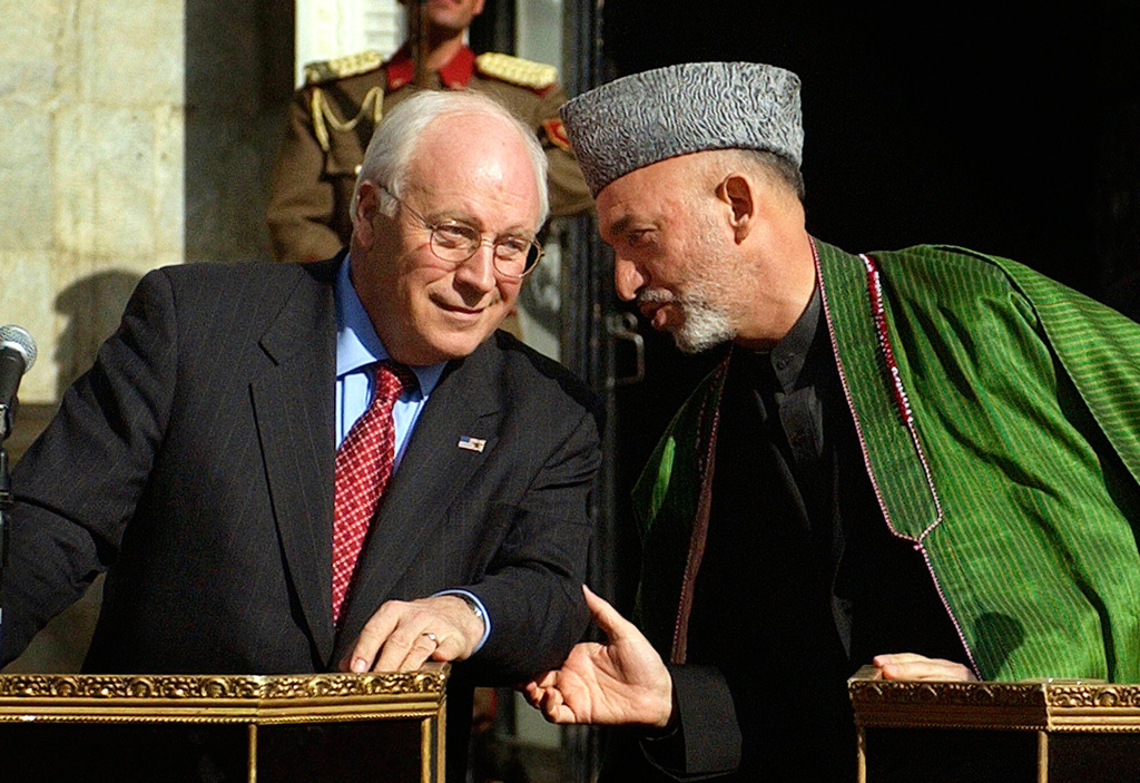 FILE - Afghan President Hamid Karzai, right, talks with U.S. Vice President Dick Cheney during a press conference at the presidential palace in Kabul, Afghanistan, on Tuesday, Dec. 7. 2004 after Karzai's inauguration. (AP Photo/Emilio Morenatti, file)