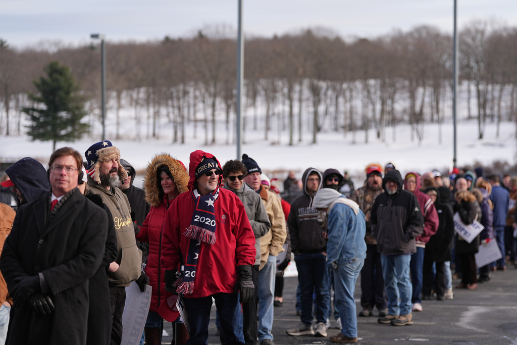 People wait in line to hear President Donald Trump speak at the Mount Airy Casino Resort in Mt. Pocono, Pa., Tuesday, Dec. 9, 2025. (AP Photo/Matt Rourke)
