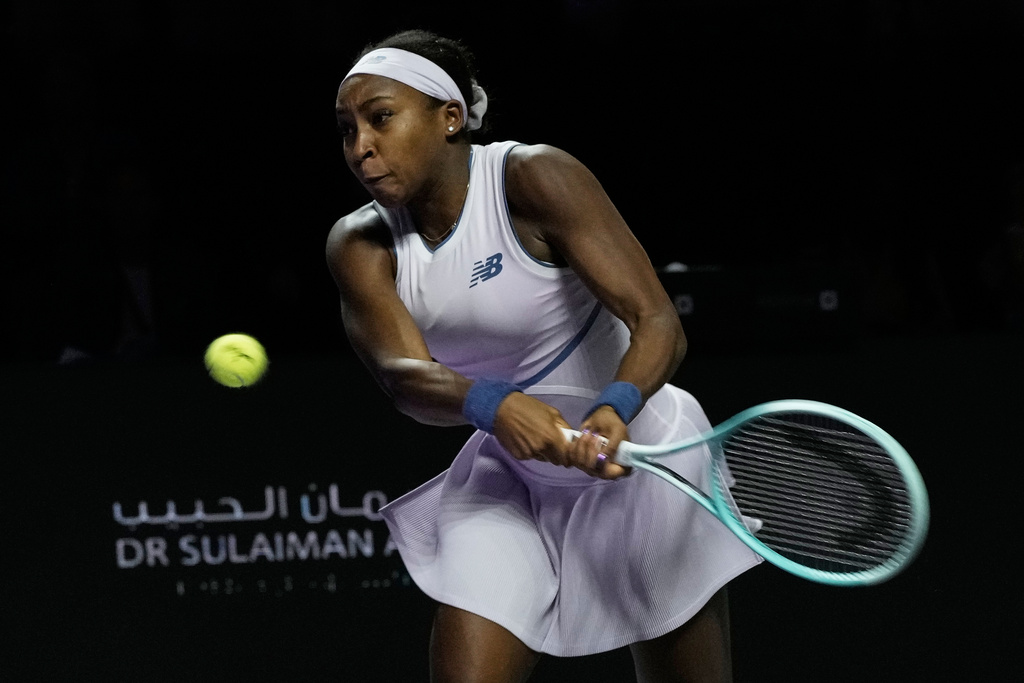 Coco Gauff of the United States plays a backhand return to Aryna Sabalenka of Belarus during their women's singles match at the WTA tennis finals in Riyadh, Saudi Arabia, Thursday, Nov. 6, 2025. (AP Photo/Fatima Shbair)