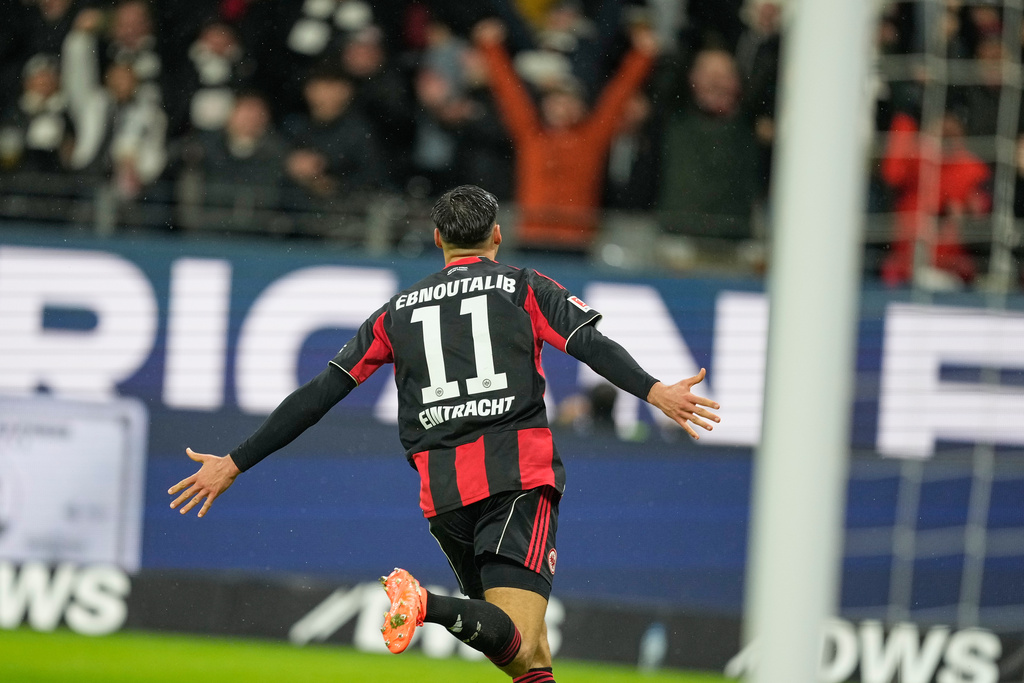 Frankfurt's Younes Ebnoutalib celebrates after scoring his side's second goal during the Bundesliga soccer match between Eintracht Frankfurt and Borussia Dortmund in Frankfurt, Germany, Friday, Jan. 9, 2026. (AP Photo/Michael Probst)