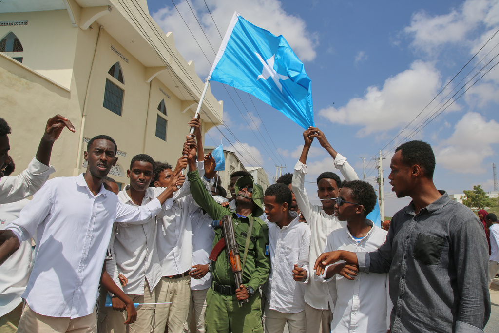 People raise Somalia's flag as they protest Israel's recognition of Somalia's breakaway region of Somaliland as an independent nation, in Mogadishu, Somalia, Tuesday, Dec. 30, 2025. (AP photo/Farah Abdi Warsameh)