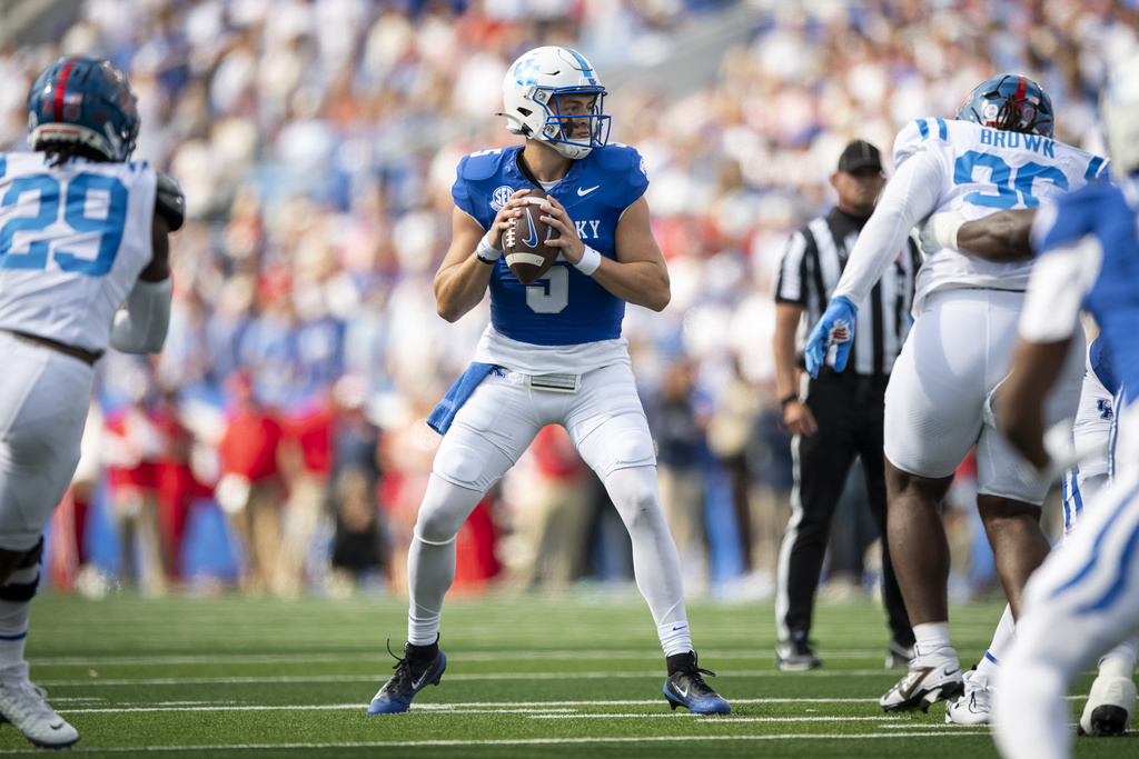 Kentucky quarterback Zach Calzada (5) looks for an open receiver during the first half of an NCCA college football game against Mississippi in Lexington, Ky., Saturday, Sept. 6, 2025. (AP Photo/Tanner Pearson)