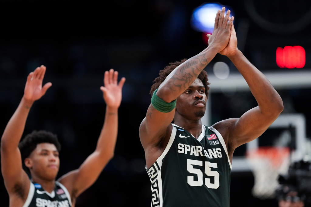 Michigan State forward (55) waves to fans after the second half in the Sweet 16 of the NCAA college basketball tournament against UConn, Saturday, March 28, 2026, in Washington. (AP Photo/Stephanie Scarbrough)