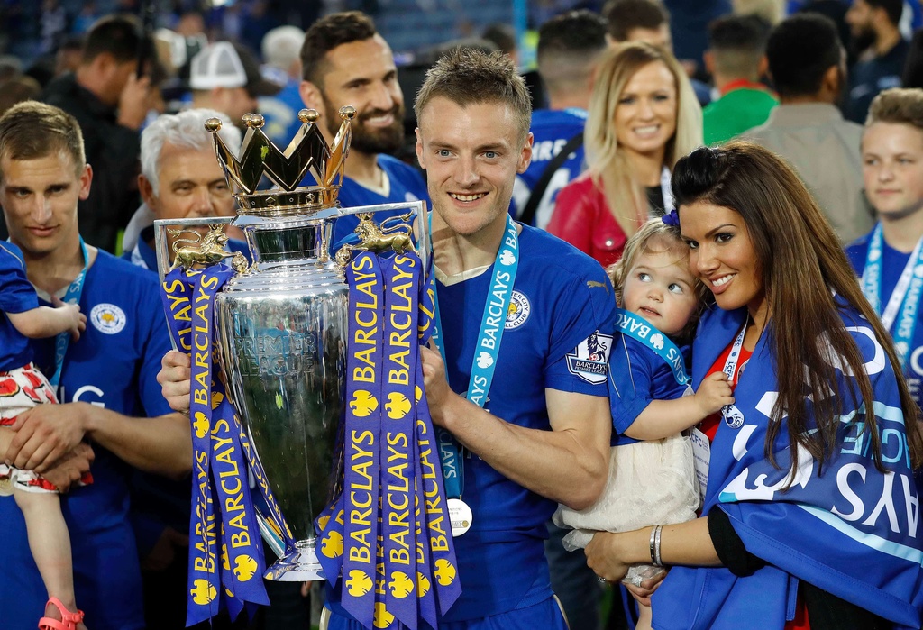 FILE - Leicester's Jamie Vardy lifts the trophy as Leicester City celebrate becoming the English Premier League soccer champions at King Power stadium in Leicester, England, Saturday, May 7, 2016. (AP Photo/Matt Dunham, File)