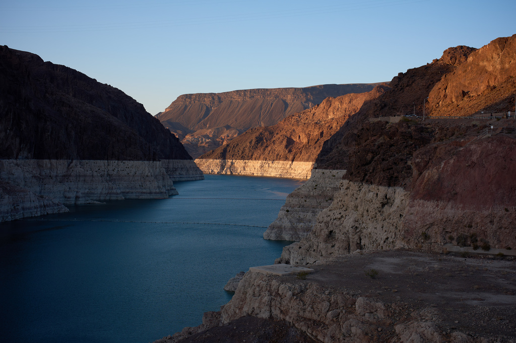 A bathtub ring of light minerals shows the high water line of Lake Mead near Hoover Dam at the Lake Mead National Recreation Area on Tuesday, June 30, 2026, near Boulder City, Nev. (AP Photo/John Locher)