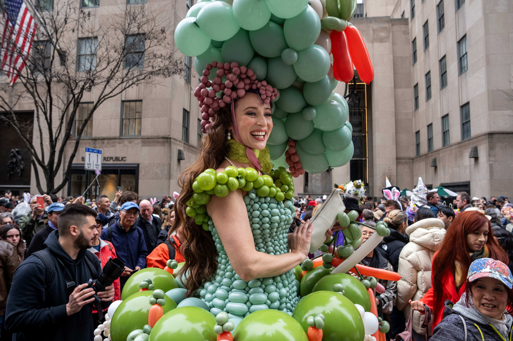 Tommi May wears a costume of balloons as they participate in the Easter Bonnet Parade on Fifth Avenue, Sunday, April 5, 2026, in New York. (AP Photo/Adam Gray)
