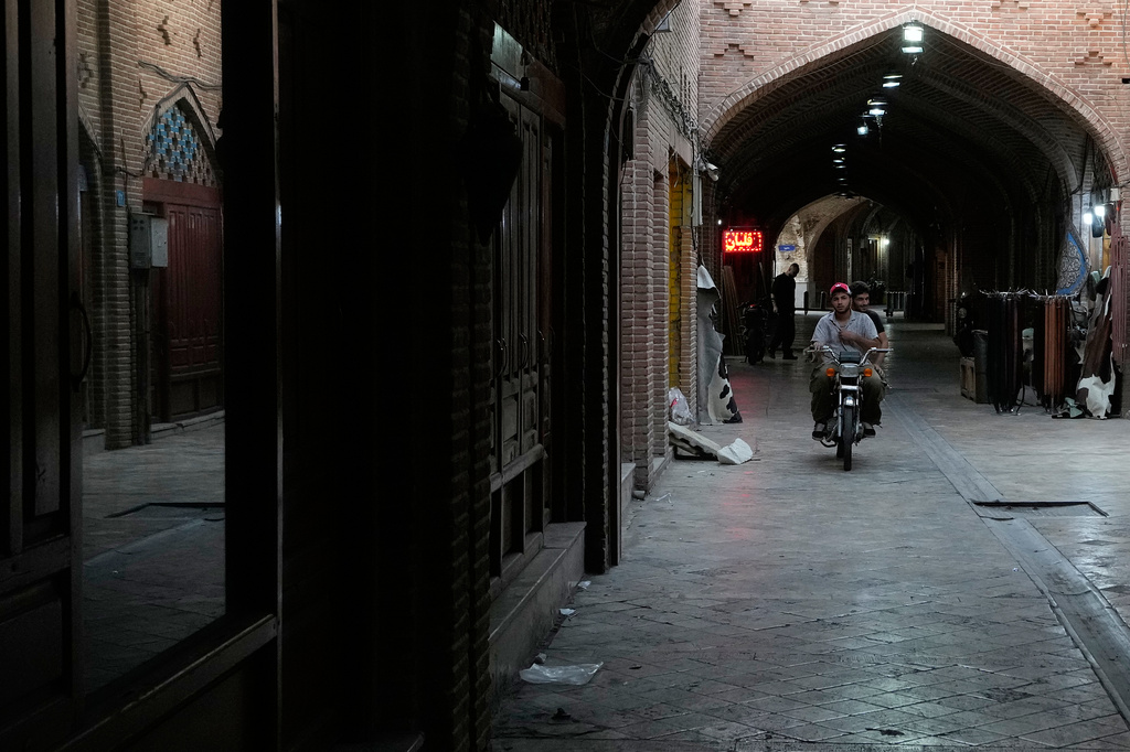 Men ride on their motorbike at the historic neighborhood of Oudlajan in Tehran, Iran, Thursday, May 28, 2026. (AP Photo/Vahid Salemi)