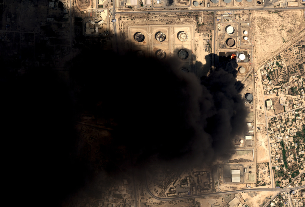 This satellite image from Airbus Defence and Space's Pléiades Neo satellite shows smoke coming from Zawiya oil refinery in Zawiya, Libya, Tuesday, Aug. 11, 2026. (Pléiades Neo © Airbus DS 2026, via AP)