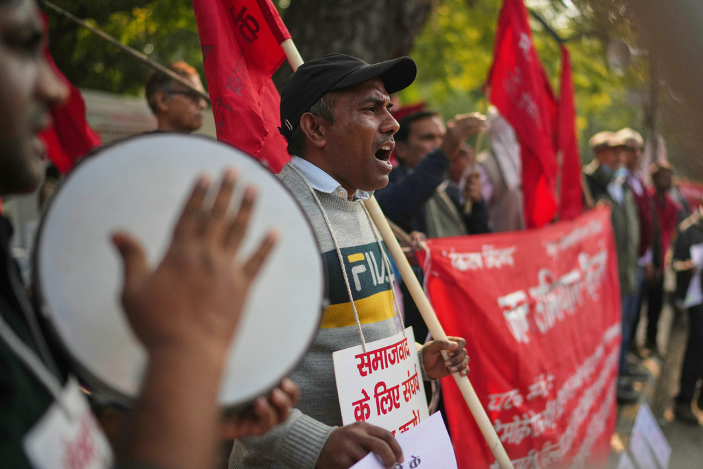 Members of various Indian trade unions shout slogans during a protest against the government's rollout of new labor codes in New Delhi, India, Wednesday, Nov. 26, 2025. (AP Photo/Manish Swarup)