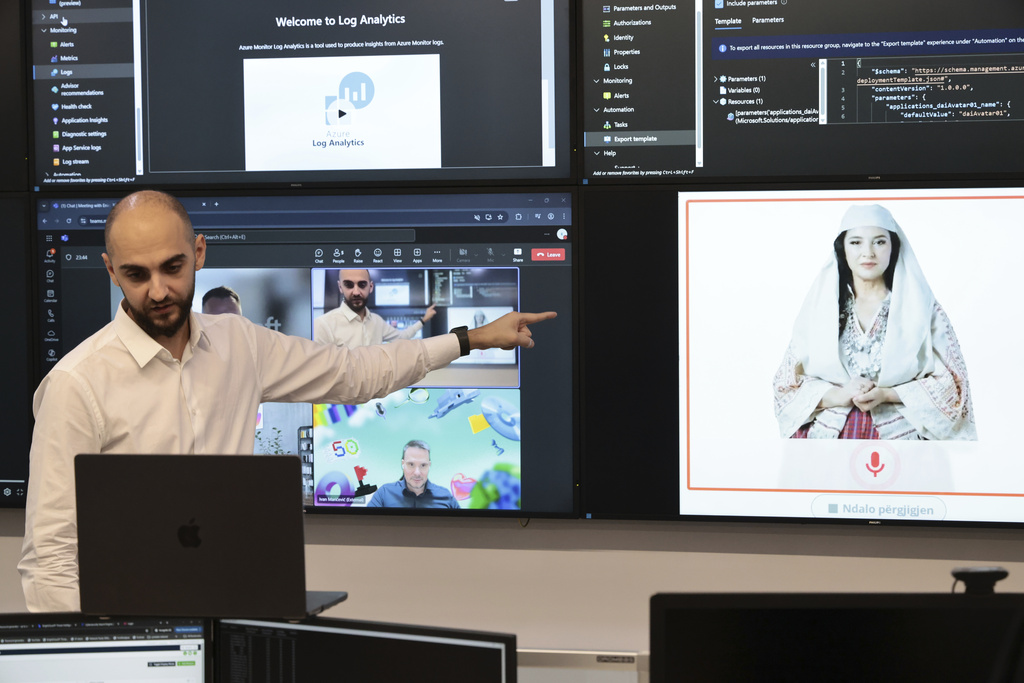 Enio Kaso, head of the Department of Artificial Intelligence and Cryptocurrency Licensing shows the AI "minister" Diella, whose name means "Sun" in Albanian, during a conference call in Tirana, Albania, Friday, Sept. 12, 2025. (AP Photo/Vlasov Sulaj)