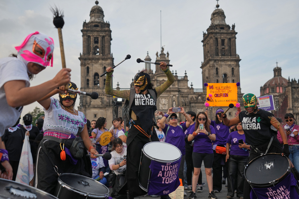 Demonstrators attend a protest marking International Day for the Elimination of Violence Against Women in Mexico City, Tuesday, Nov. 25, 2025. (AP Photo/Claudia Rosel)