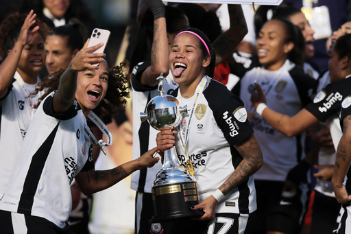 Players of Brazil's Corinthians celebrate with the trophy after defeating Colombia's Deportivo Cali and winning the Women's Copa Libertadores final soccer match in Buenos Aires, Argentina, Saturday, Oct. 18, 2025. (AP Photo/Luciano Gonzalez) Players of Brazil's Corinthians celebrate with the trophy after defeating Colombia's Deportivo Cali and winning the Women's Copa Libertadores final soccer match in Buenos Aires, Argentina, Saturday, Oct. 18, 2025. (AP Photo/Luciano Gonzalez)