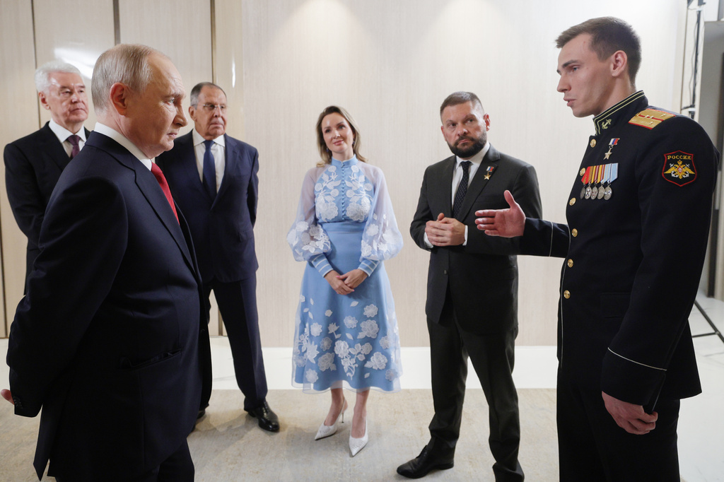 FILE - Russian President Vladimir Putin, foreground left, meets with United Russia party leaders, from left, Moscow Mayor Sergei Sobyanin; Putin; Foreign Minister Sergey Lavrov, background second right, Presidential Commissioner for Children's Rights Maria Lvova-Belova, center; war correspondent and Hero of Russia Yevgeny Poddubny, second right; and Chief of the Yunarmiya main headquarters Vladislav Golovin, in Moscow, on Saturday, Sept. 5, 2026. (Gavriil Grigorov/Sputnik, Kremlin Pool Photo via AP, File)
