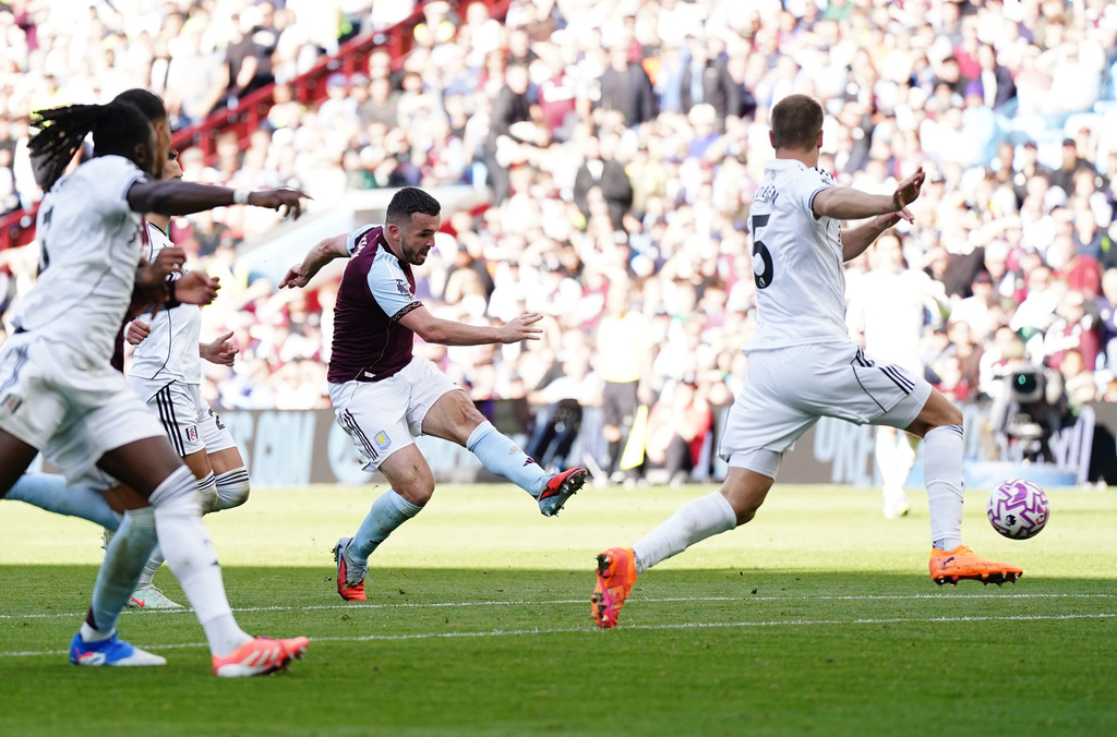 Aston Villa's John McGinn shoots to score his team's second goal during the English Premier League soccer match between Aston Villa and Fulham at Villa Park, Birmingham, England, Sunday, Sept. 28, 2025. (Jacob King/PA via AP)
