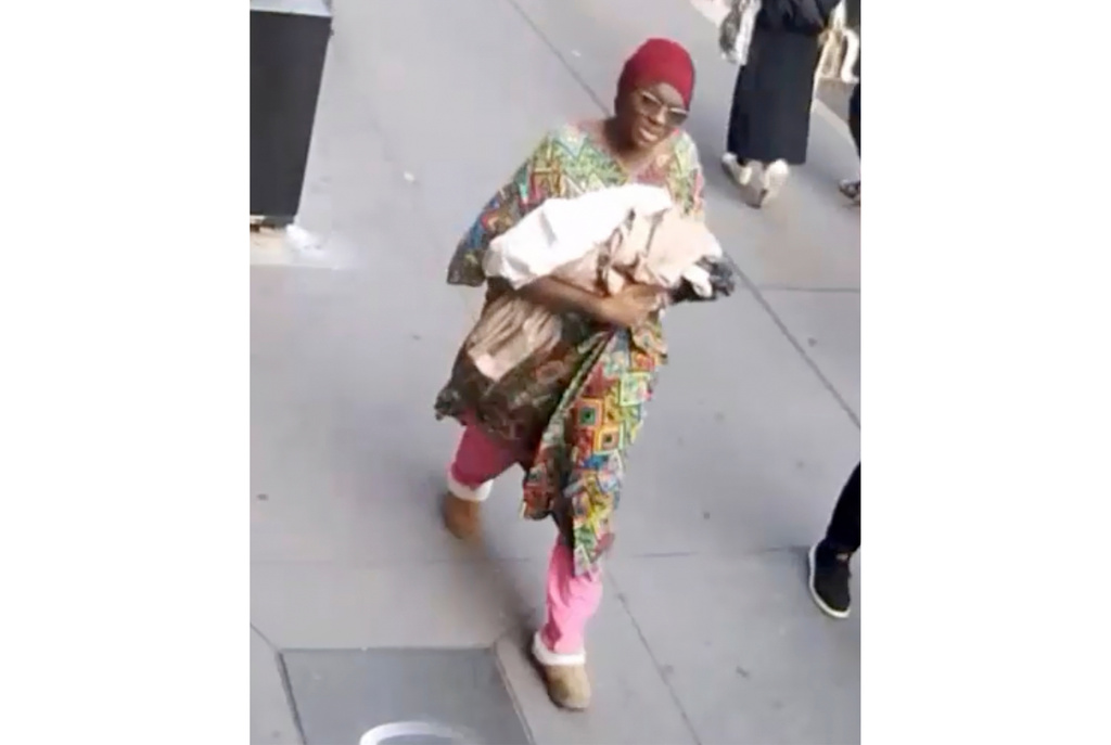 This photo taken from surveillance video footage provided by the New York Police Department, shows a woman who is wanted for questioning after an infant girl was abandoned at a New York City subway station Monday, Oct. 20, 2025 in New York. (New York Police Department via AP)