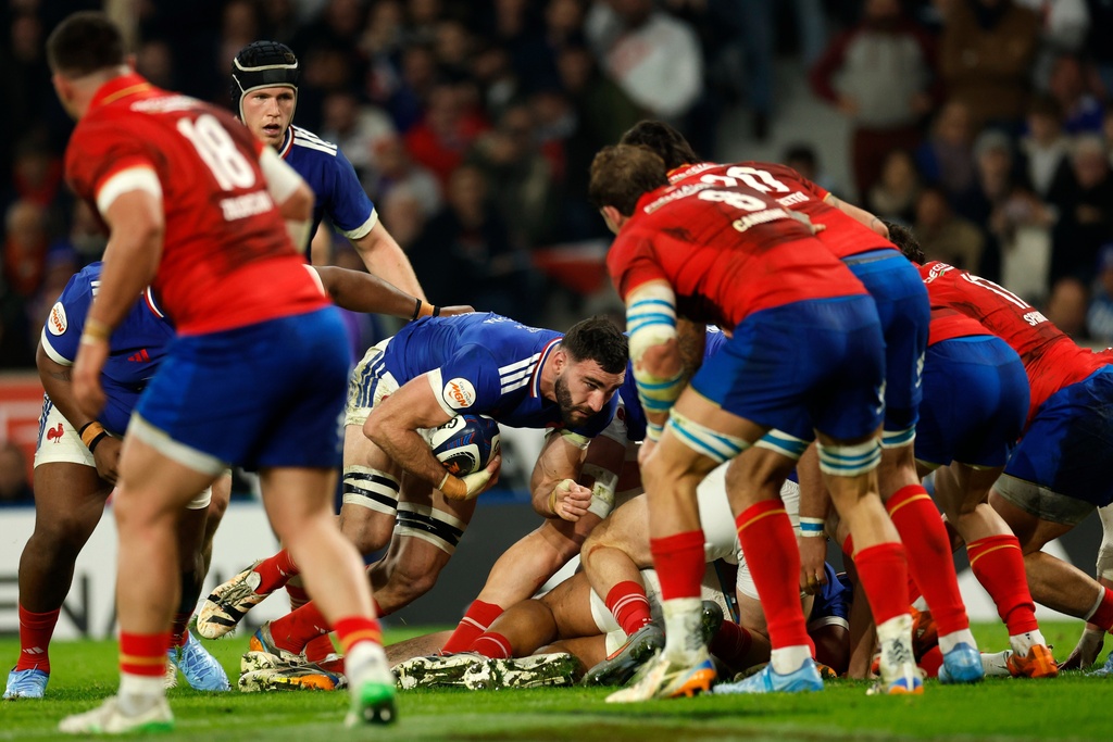 France's Charles Ollivon, center, hold s the ball during the Six Nations rugby union match between France and Italy in Lille, France, Sunday, Feb. 22, 2026. (AP Photo/Jean-Francois Badias)