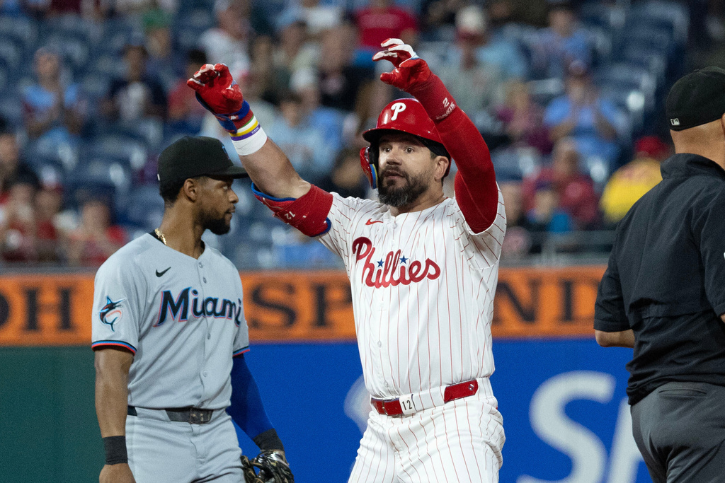 Philadelphia Phillies' Kyle Schwarber gestures from second base after hitting a double in the first inning of a baseball game against the Miami Marlins, Wednesday, Sept. 24, 2025, in Philadelphia. (AP Photo/Laurence Kesterson)