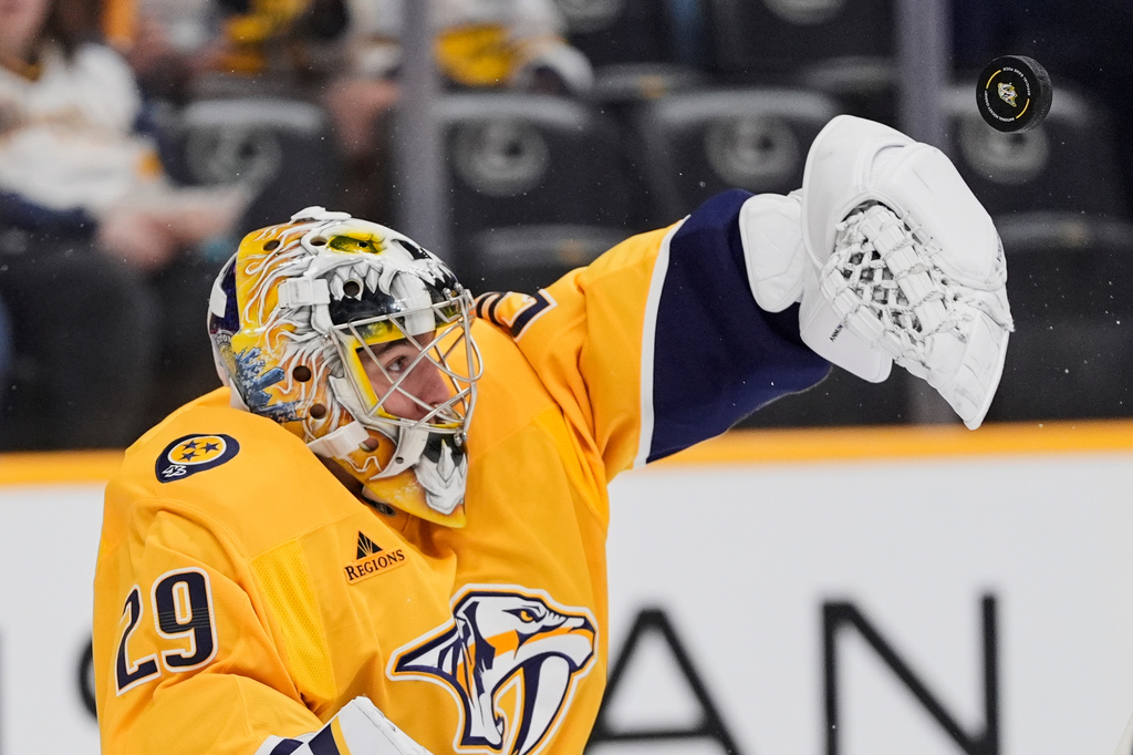Nashville Predators goaltender Justus Annunen (29) blocks a shot on goal during the first period of an NHL hockey game against the New Jersey Devils, Thursday, March 26, 2026, in Nashville, Tenn. (AP Photo/George Walker IV)