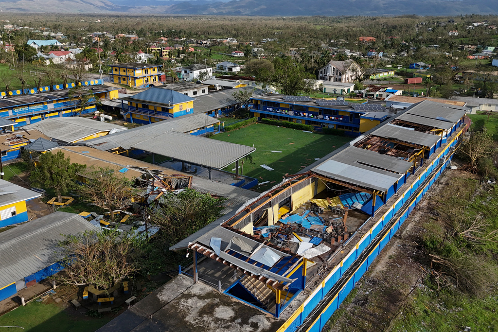 Parts of the roof of the St. Elizabeth Technical High School are missing in Santa Cruz, Jamaica, Wednesday, Oct. 29, 2025, after Hurricane Melissa passed. (AP Photo/Matias Delacroix)