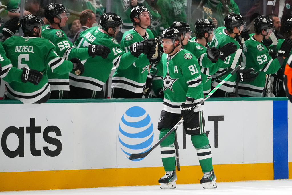Dallas Stars center Tyler Seguin skates by his bench after scoring a goal against the Columbus Blue Jackets during the second period of an NHL hockey game Tuesday, Oct. 21, 2025, in Dallas. (AP Photo/Julio Cortez)